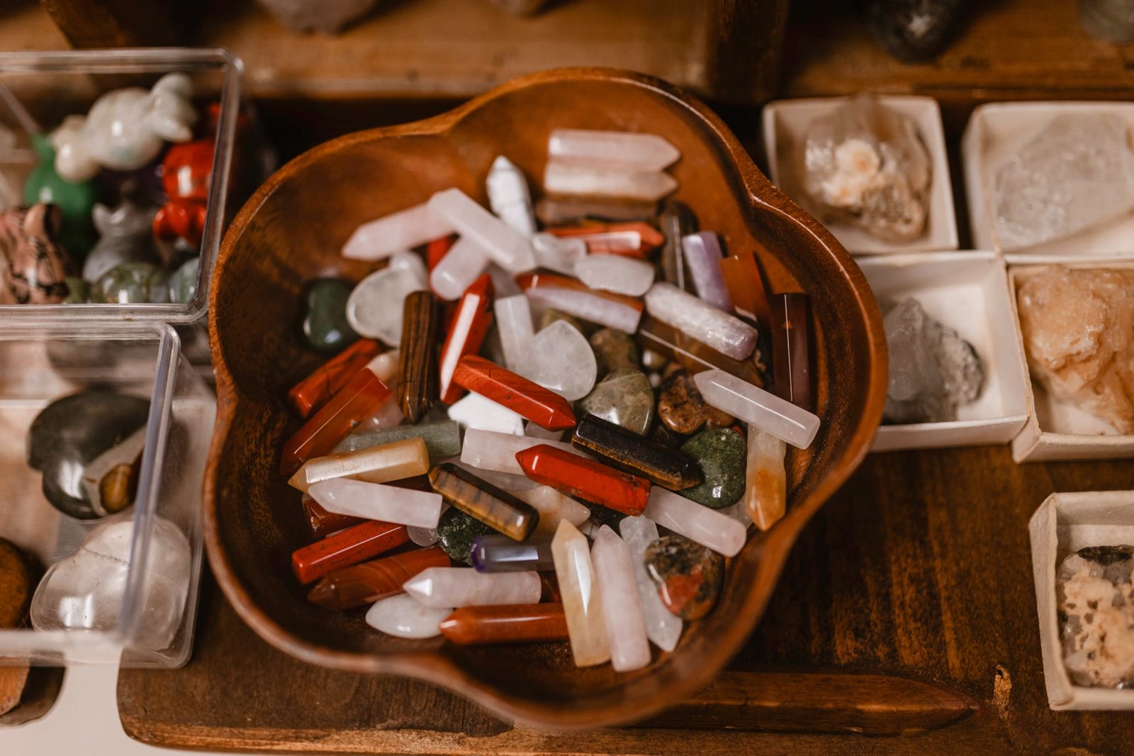 A wooden bowl of polished crystals and stones